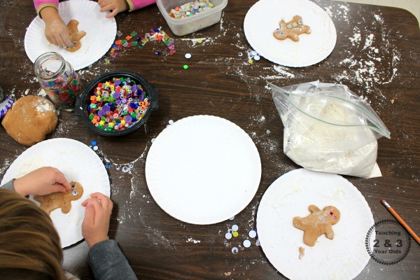 Putting together these easy gingerbread ornaments is super simple. We love adding this Christmas activity to our gingerbread theme!